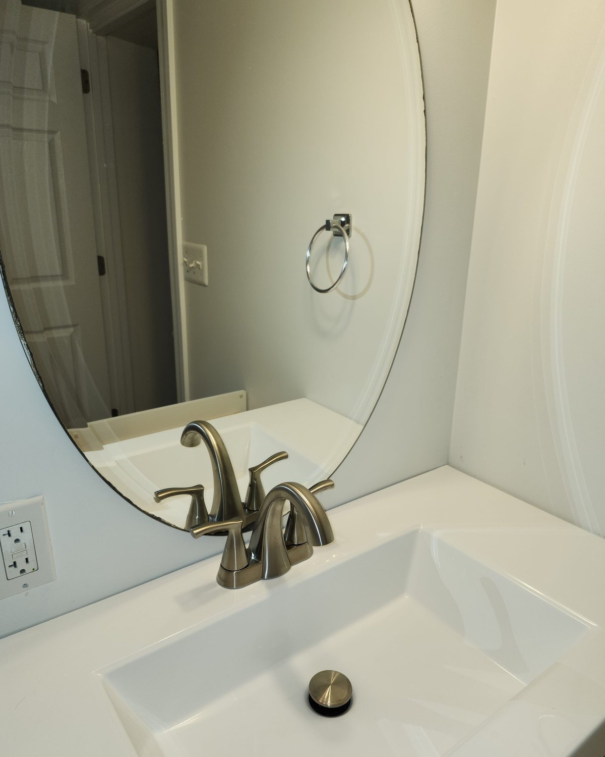 A cleaned bathroom vanity, sink and mirror &mdash; a photograph of Perham Services&rsquo; own work