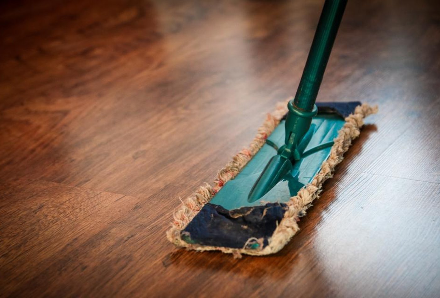 A hard floor washed by hand &mdash; representative imagery, not a specific Perham Services job
